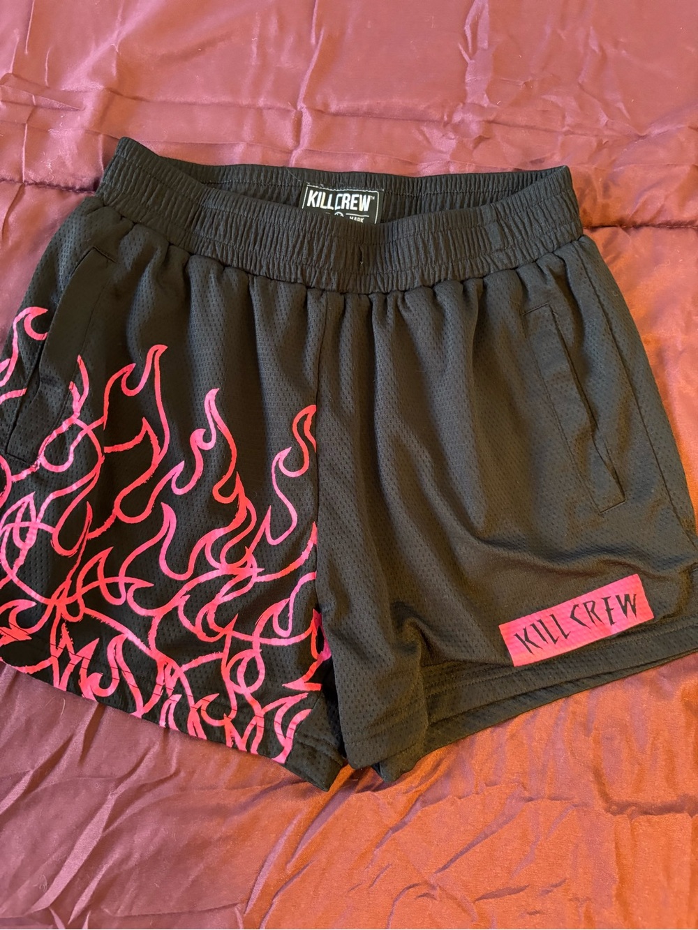 Killcrew black shorts with pink flame graphic